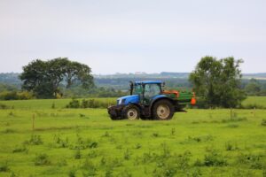 global conflict fertiliser tractor in field